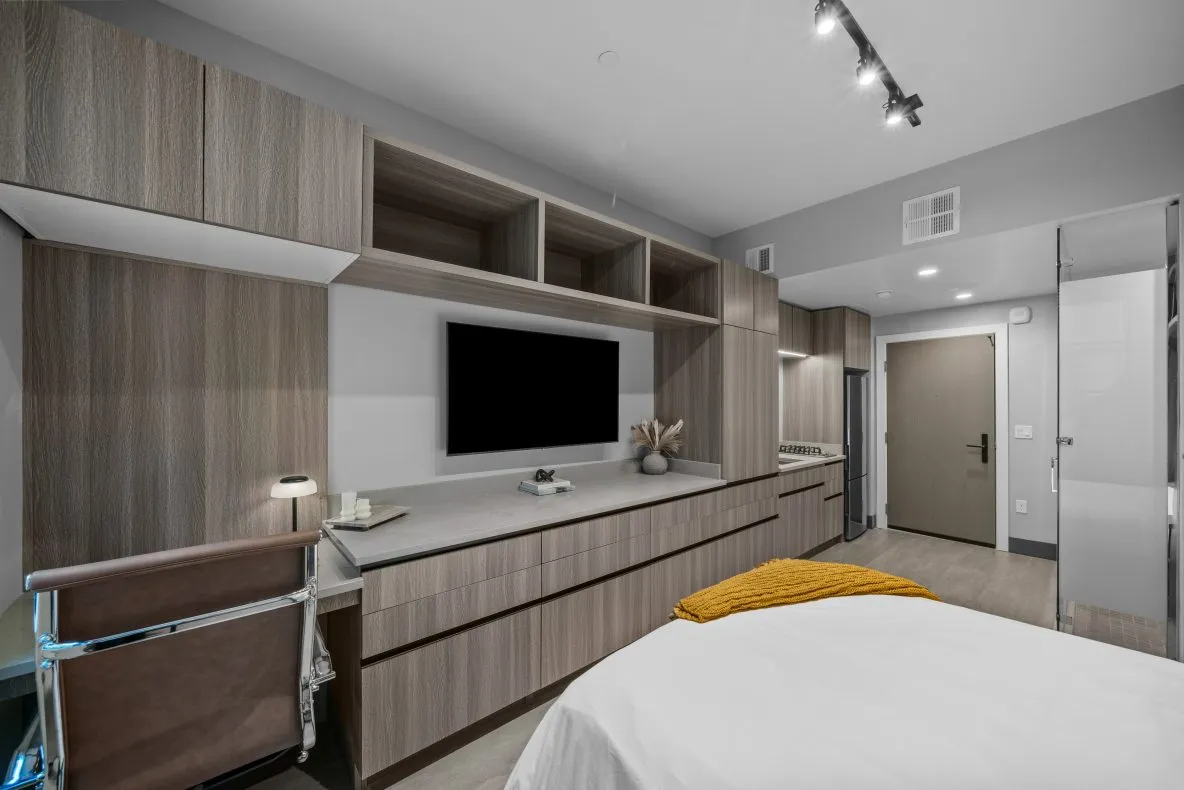Fully-furnished studio apartment with built in desk and TV at Salt Lake Crossing.